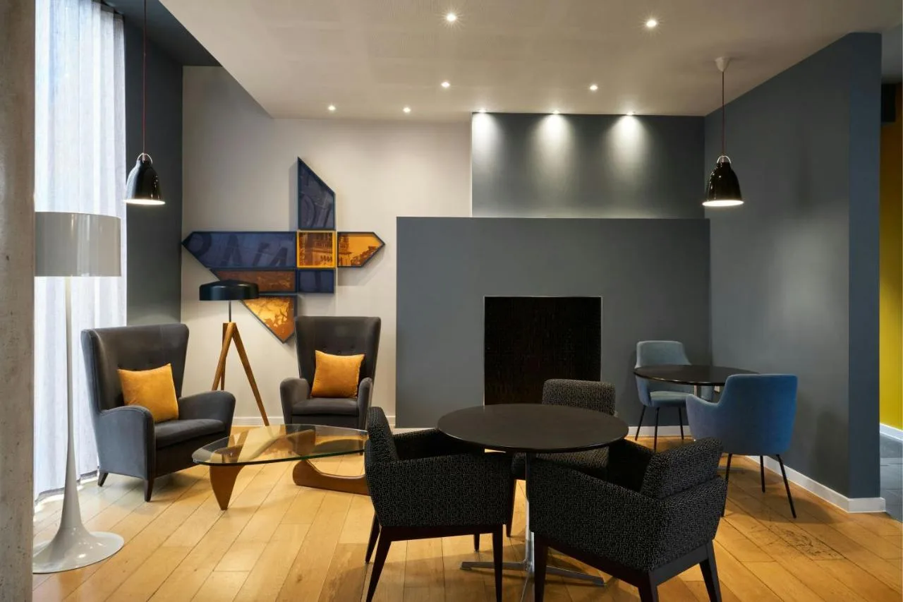 Lounge with fireplace and seating at Four Points Flex by Sheraton Cardiff